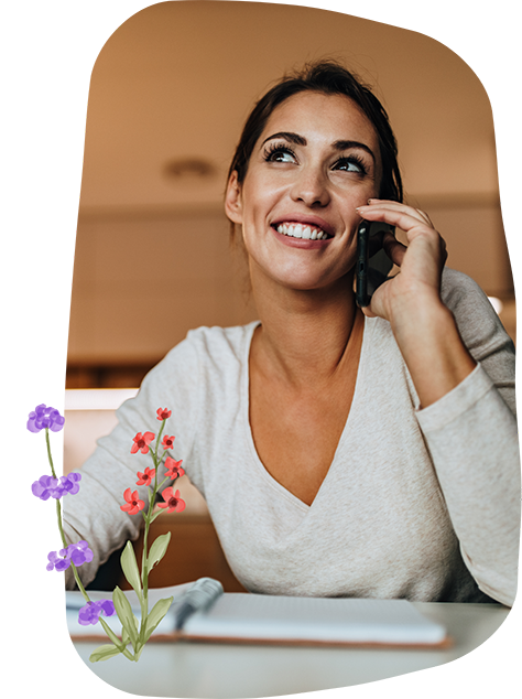 Woman talking on the phone with a pediatric dental office in Bellaire