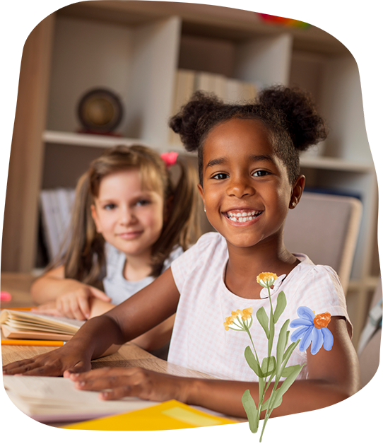 Girl smiling at a classroom desk