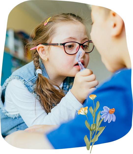 Young girl holding a dental mirror