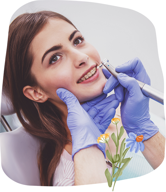 Teenage girl getting a dental cleaning