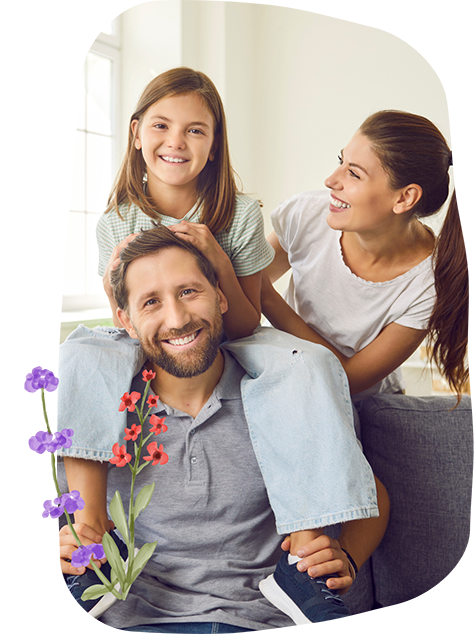 Family of three smiling at home