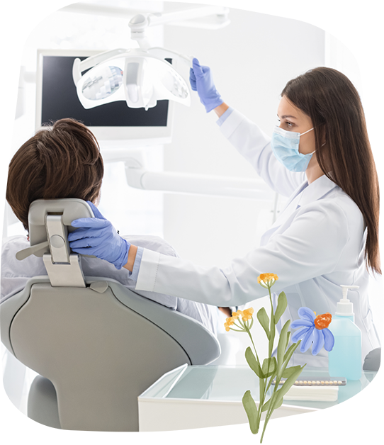 Dentist preparing to take x rays of a patient's mouth