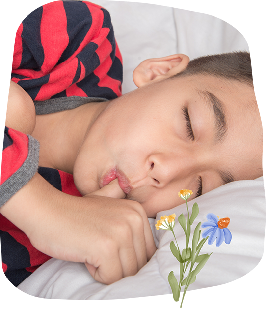 Boy sucking his thumb while sleeping