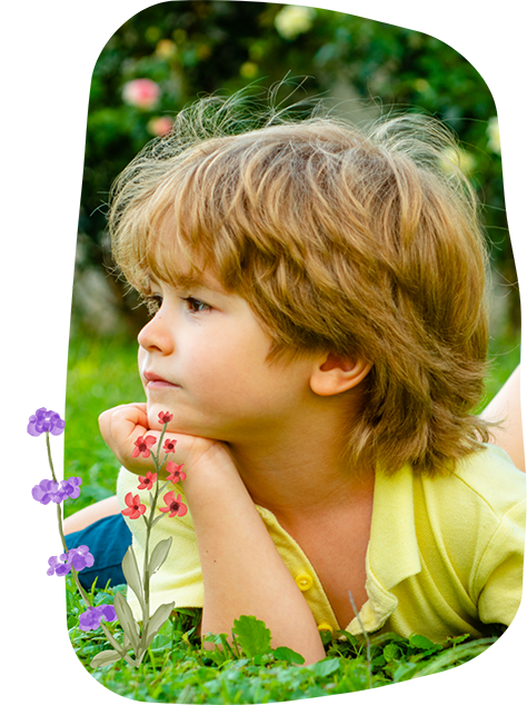 Child lying in the grass