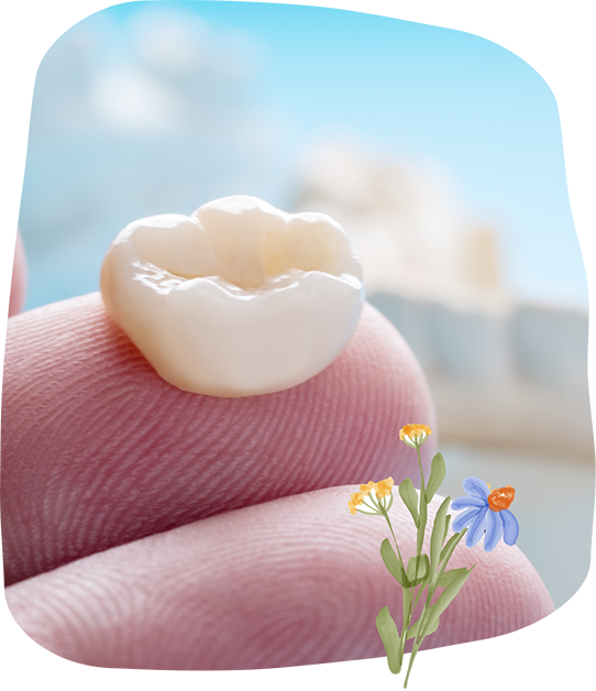 Dental crown resting on a person's finger