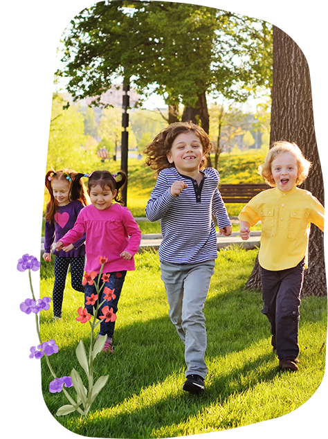 Kids playing in a park after seeing a pediatric dentist in Bellaire