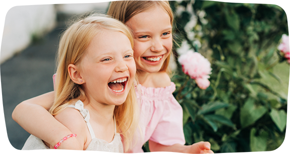 Two smiling blonde girls